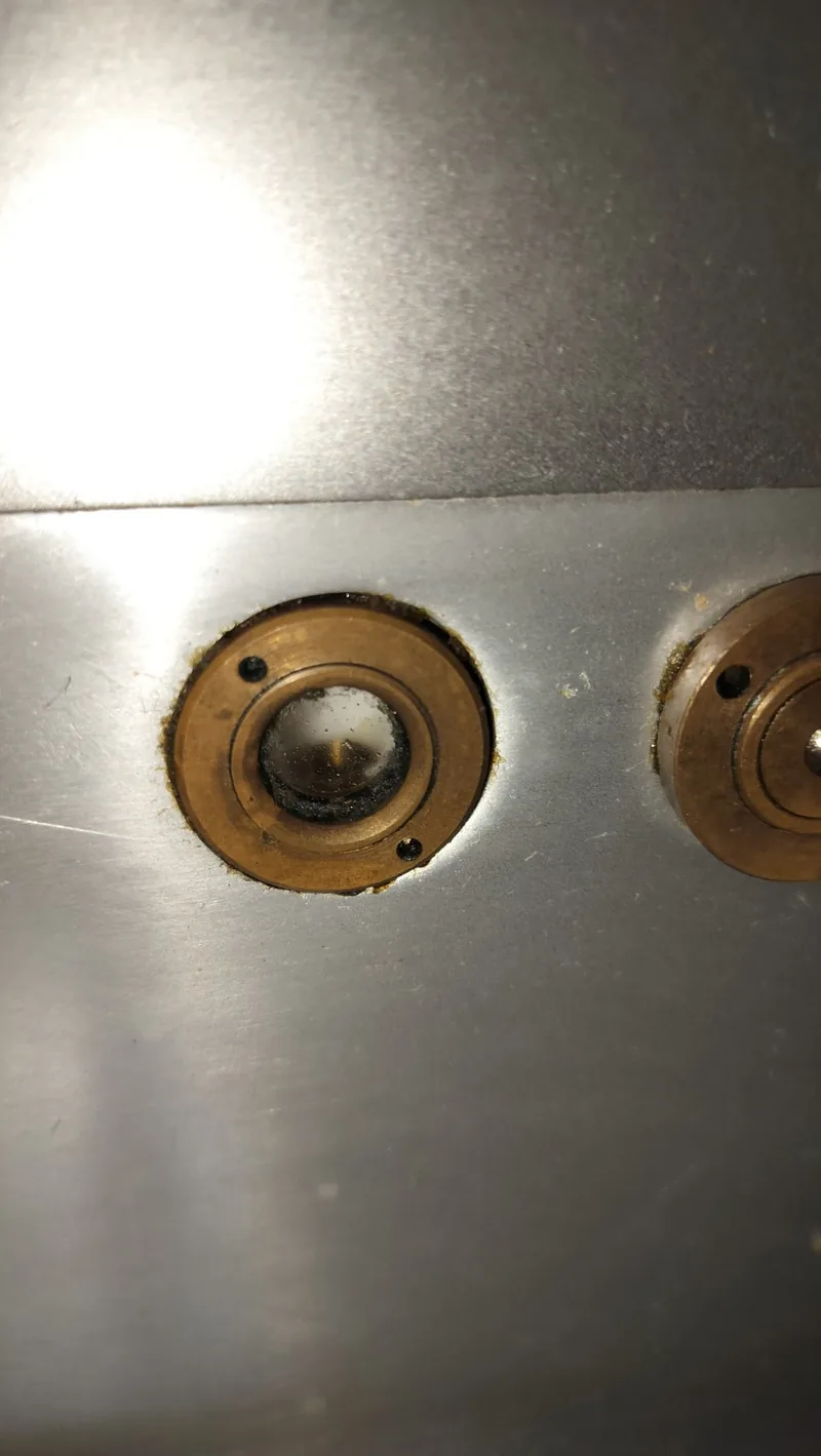 Close-up of the oil-level sight glass on the Avantco meat slicer