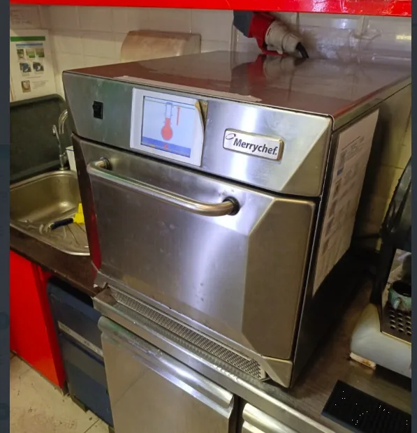 Merrychef countertop high-speed oven in a commercial kitchen.