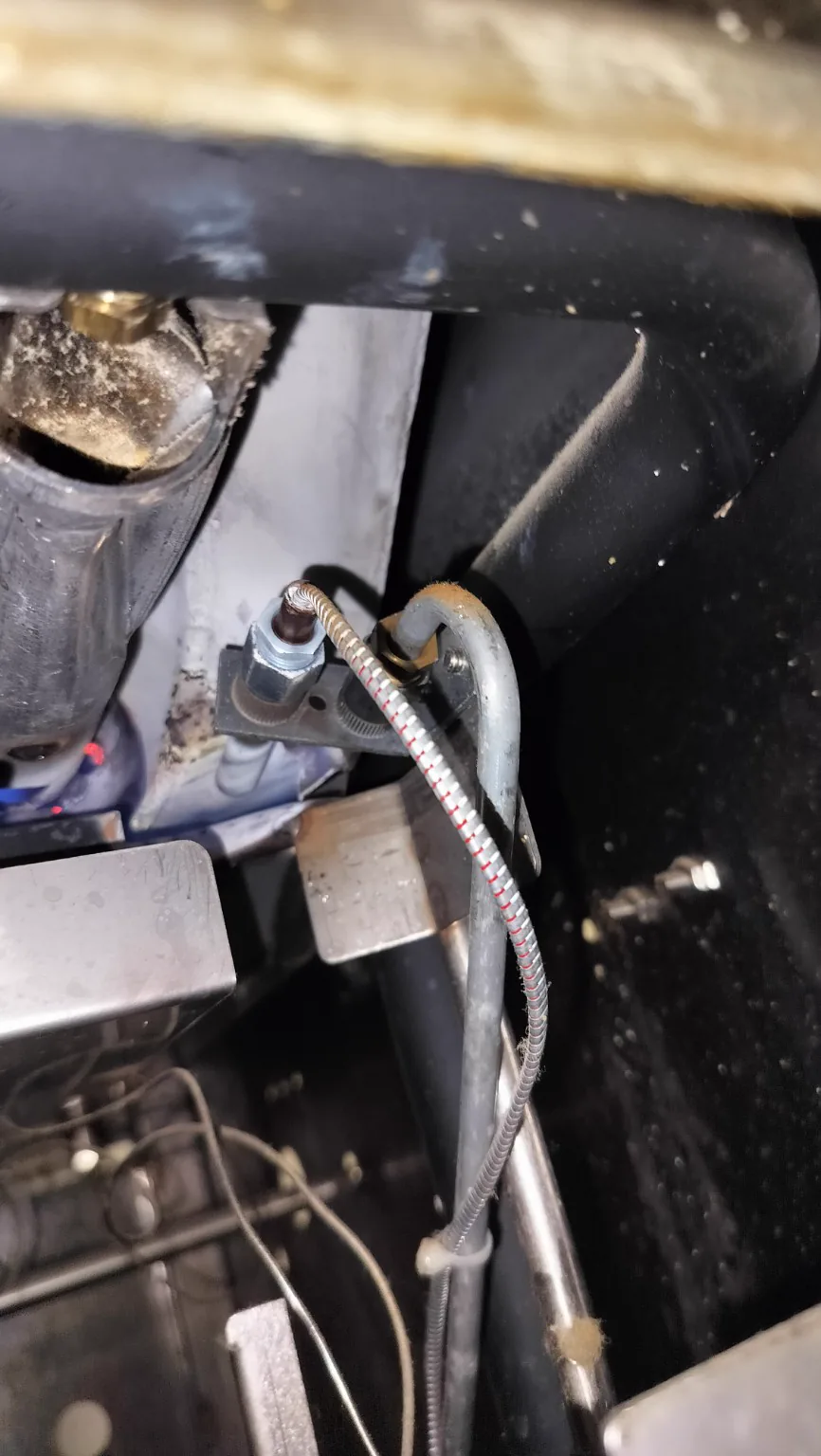 Pilot and thermopile area of a Belshaw gas fryer during diagnostic inspection.
