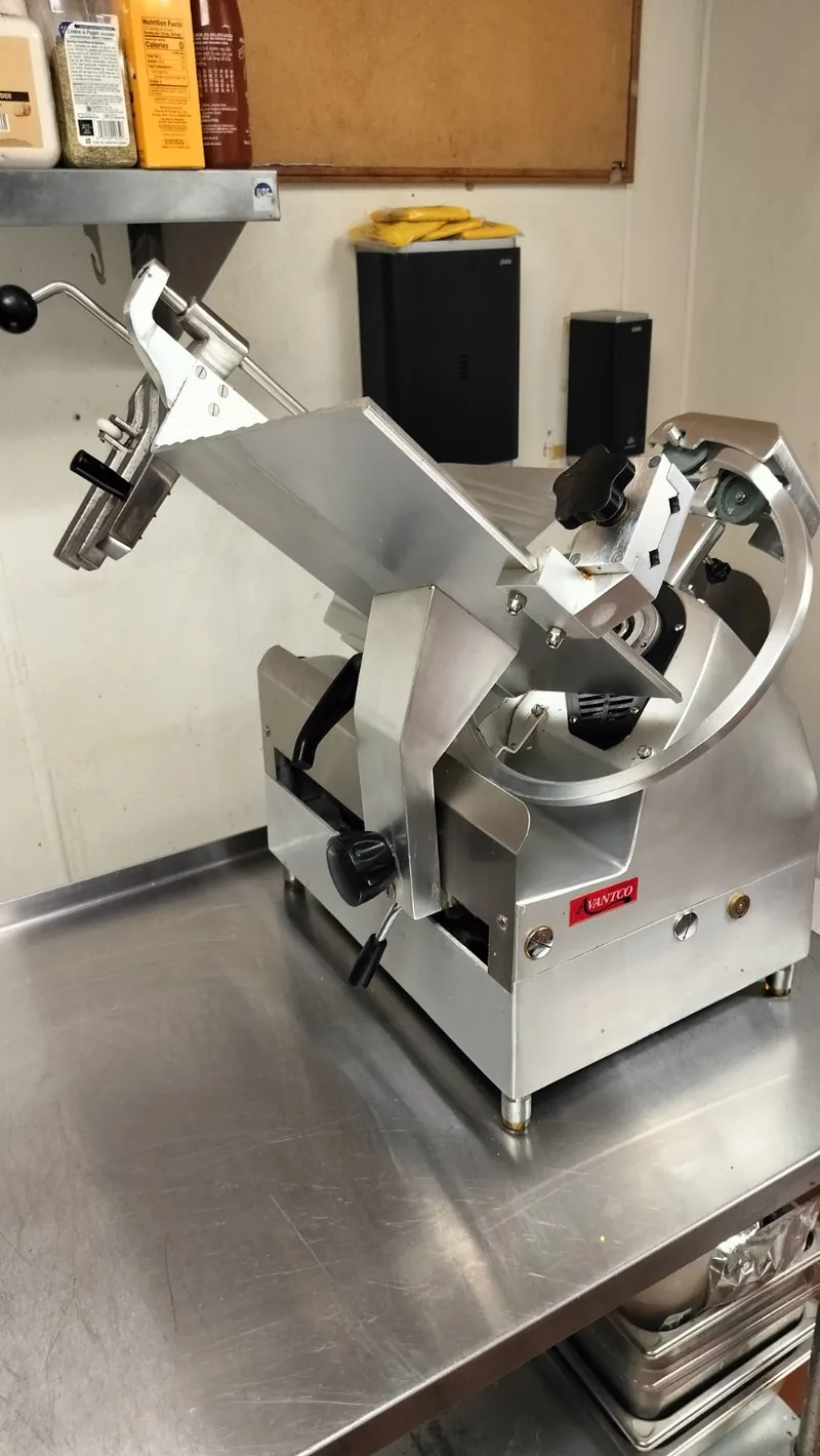 Avantco SL713A automatic meat slicer with blade removed during a service inspection