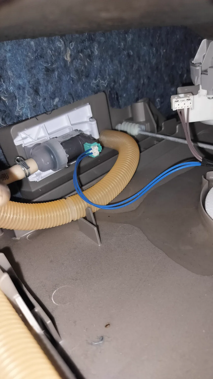 Water inlet valve and hose area inside a Bosch dishwasher during diagnosis.