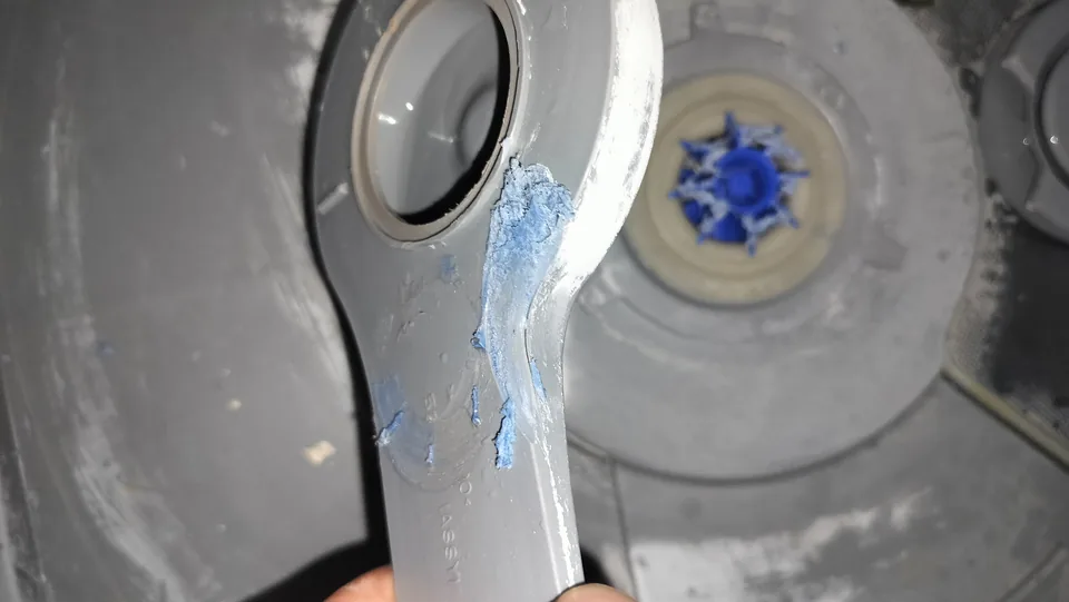 Second close view of the damaged DishDrawer spray arm and central mounting area