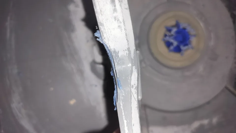 Close view of damage along the DishDrawer spray arm near the rotor mounting