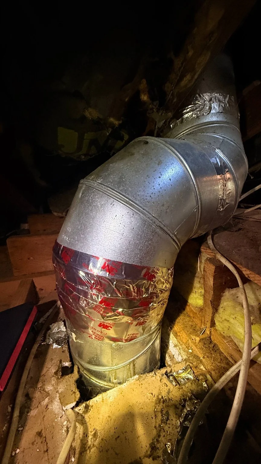 Metal kitchen exhaust duct elbow and vertical connection with foil sealing in the attic