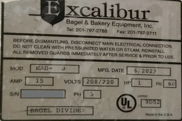 Excalibur bagel-divider plate with worn model digits and serial redacted