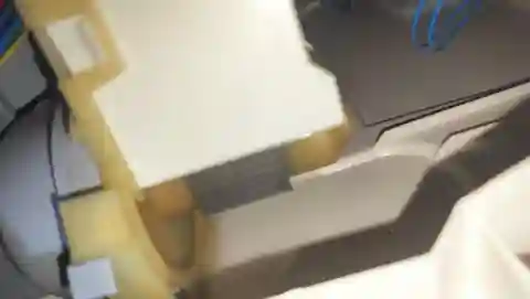 Hestan KDW24 dishwasher drain pump exposed during lower-access diagnosis.