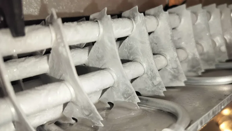 Frost buildup across a Miele K1901Vi refrigerator evaporator during diagnosis.
