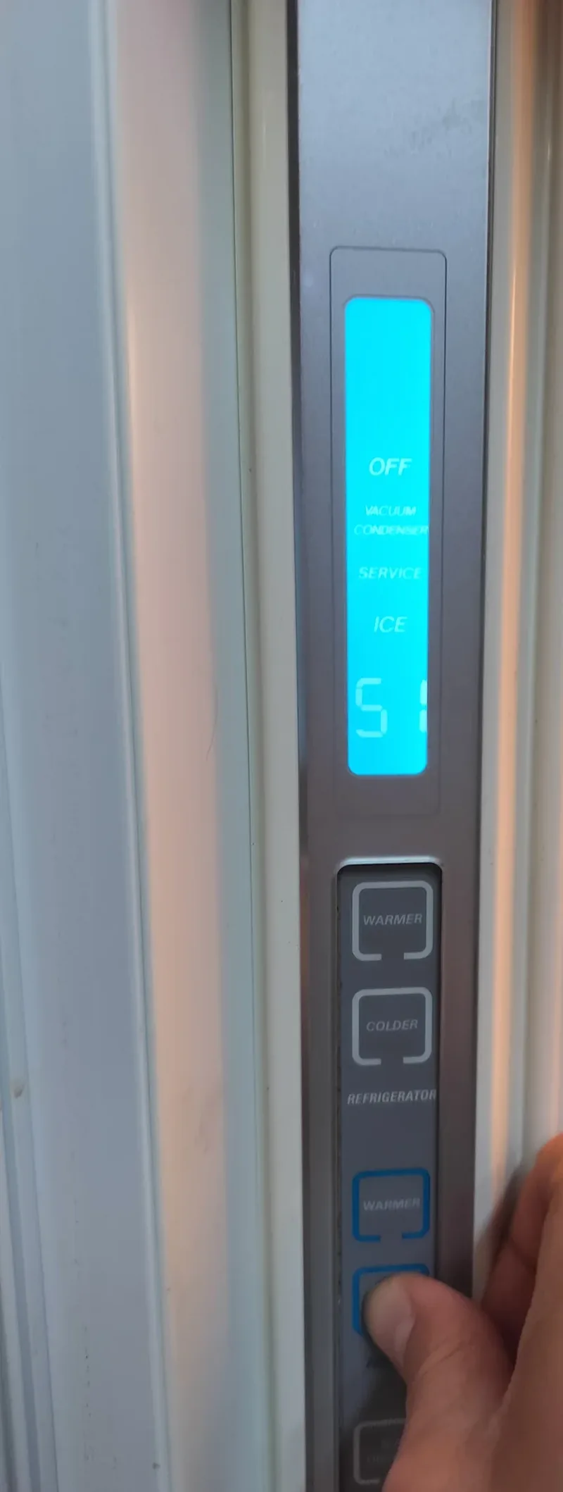 Sub-Zero 690 display showing a warm temperature and Vacuum Condenser message during diagnosis.